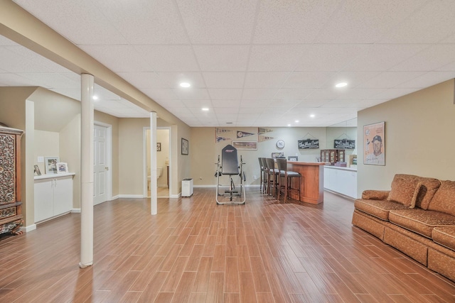 28 Hamlet Dr, Commack, NY 11725 - living area with bar, light wood-style flooring, a paneled ceiling, and recessed lighting