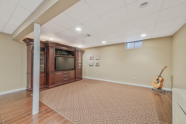 28 Hamlet Dr, Commack, NY 11725 - below grade area with light wood-style flooring, recessed lighting, and a drop ceiling