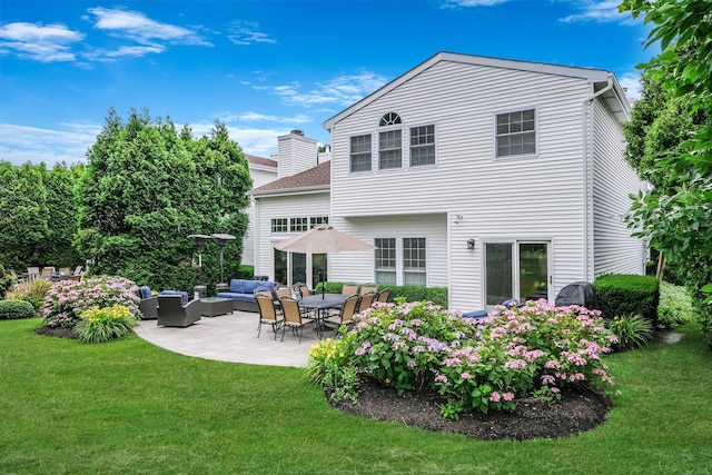 28 Hamlet Dr, Commack, NY 11725 - back of property featuring outdoor lounge area, a patio area, a yard, and a chimney