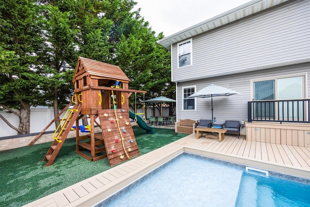 1200 Roger Rd, North Bellmore, NY 11710 - view of playground featuring a fenced backyard, an outdoor pool, and a deck