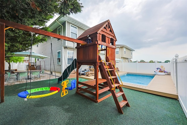 1200 Roger Rd, North Bellmore, NY 11710 - view of playground featuring a fenced backyard and a patio area