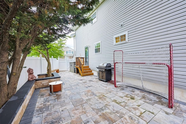 1200 Roger Rd, North Bellmore, NY 11710 - fenced backyard with a patio and area for grilling