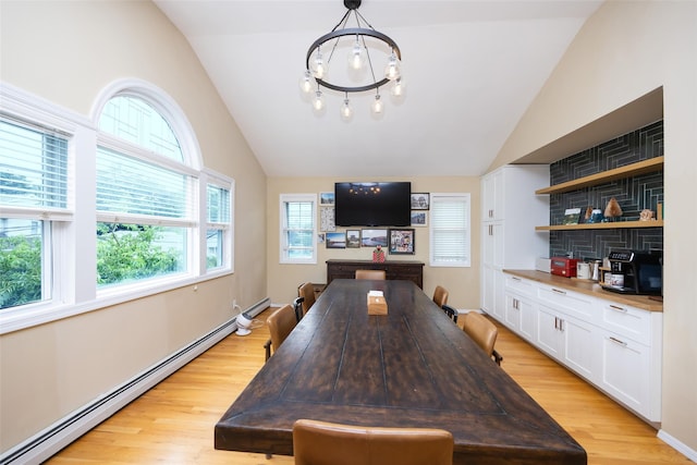 1200 Roger Rd, North Bellmore, NY 11710 - dining space featuring a baseboard radiator, vaulted ceiling, light wood-type flooring, and a chandelier