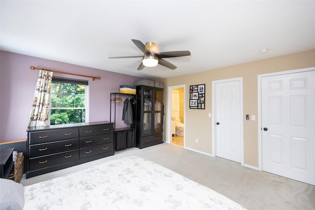 1200 Roger Rd, North Bellmore, NY 11710 - bedroom with light colored carpet, ceiling fan, and ensuite bathroom