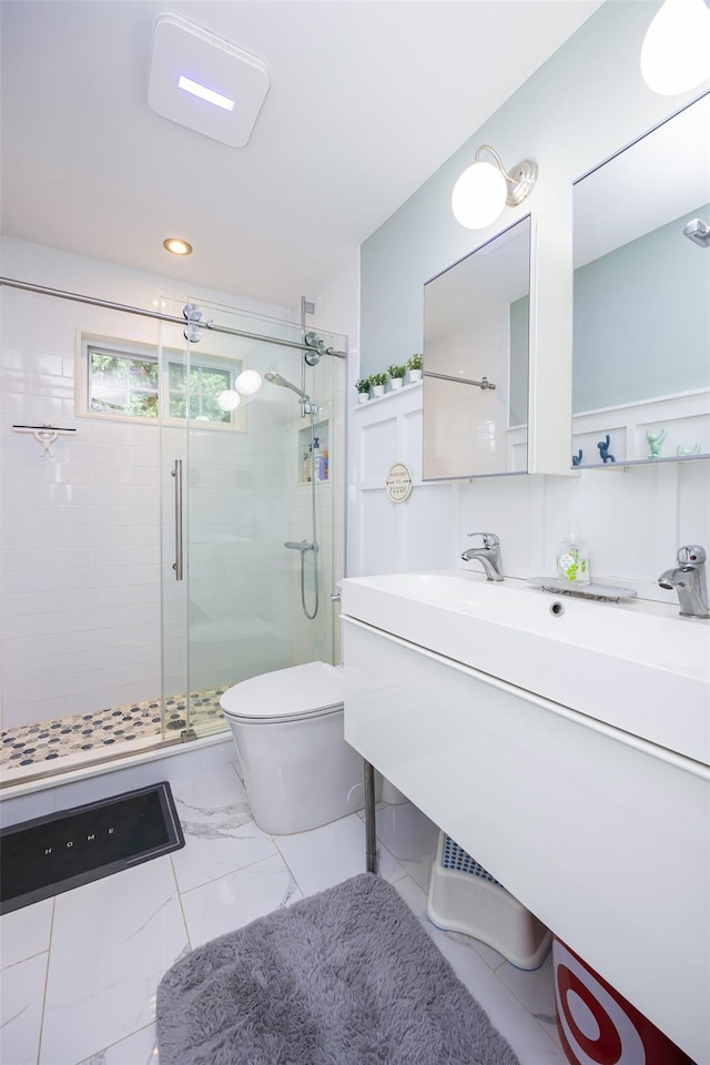 1200 Roger Rd, North Bellmore, NY 11710 - bathroom featuring a stall shower, vanity, marble finish flooring, and recessed lighting