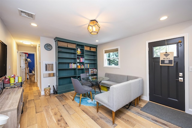 1200 Roger Rd, North Bellmore, NY 11710 - living area featuring light wood-type flooring and recessed lighting