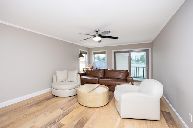 1200 Roger Rd, North Bellmore, NY 11710 - living area featuring light wood-style flooring, ceiling fan, and crown molding
