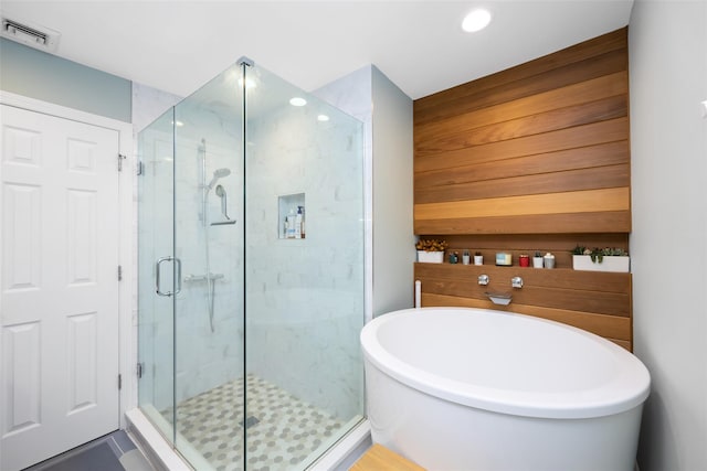1200 Roger Rd, North Bellmore, NY 11710 - full bathroom with a freestanding tub, a stall shower, and recessed lighting