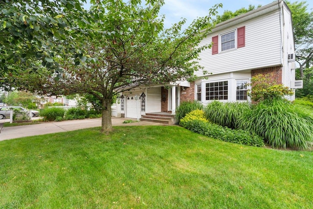 2609 Parkview Pl, Baldwin, NY 11510 - view of front of home with driveway, a front yard, and brick siding