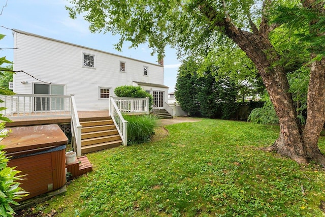 2609 Parkview Pl, Baldwin, NY 11510 - view of green lawn featuring a hot tub and a wooden deck