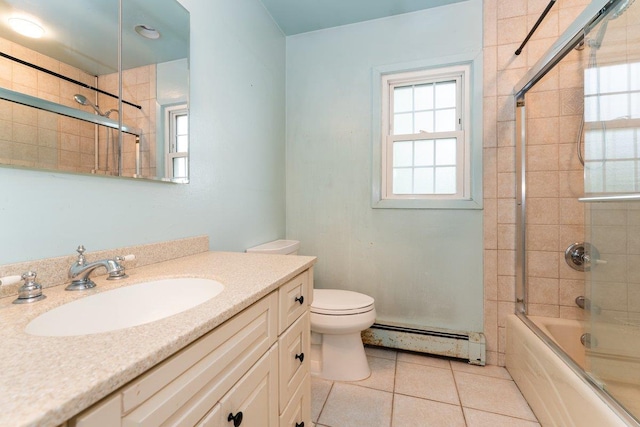 2609 Parkview Pl, Baldwin, NY 11510 - full bathroom with a baseboard heating unit, shower / bath combination with glass door, plenty of natural light, and vanity