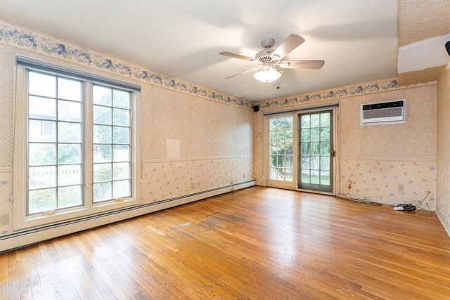 2609 Parkview Pl, Baldwin, NY 11510 - spare room with wallpapered walls, light wood-type flooring, plenty of natural light, a baseboard heating unit, and a wall mounted air conditioner