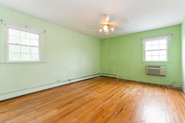 2609 Parkview Pl, Baldwin, NY 11510 - spare room with light wood-style floors, ceiling fan, and an AC wall unit