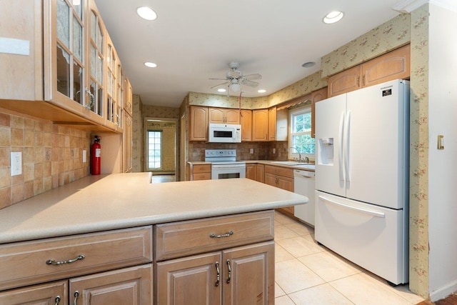 2609 Parkview Pl, Baldwin, NY 11510 - kitchen featuring white appliances, a peninsula, glass insert cabinets, decorative backsplash, and ceiling fan