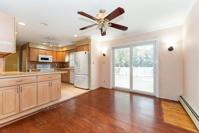 2609 Parkview Pl, Baldwin, NY 11510 - kitchen featuring white appliances, a baseboard radiator, ornamental molding, a ceiling fan, and light countertops