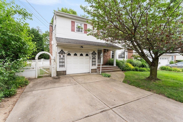 2609 Parkview Pl, Baldwin, NY 11510 - traditional-style house featuring a garage, concrete driveway, and a gate