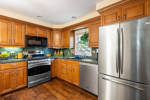 2564 Central Ave Unit B, Baldwin, NY 11510 - kitchen with stainless steel appliances, brown cabinetry, dark wood finished floors, backsplash, and recessed lighting