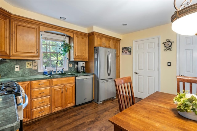2564 Central Ave Unit B, Baldwin, NY 11510 - kitchen featuring appliances with stainless steel finishes, dark wood-type flooring, brown cabinetry, backsplash, and recessed lighting