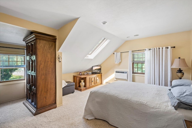 2564 Central Ave Unit B, Baldwin, NY 11510 - bedroom with a skylight, lofted ceiling, carpet, and an AC wall unit