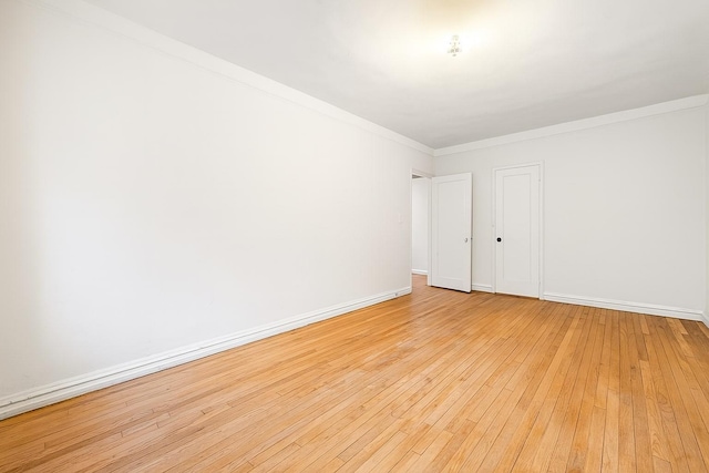 63109 Saunders St Unit 3A, Rego Park, NY 11374 - unfurnished room featuring light wood finished floors and crown molding