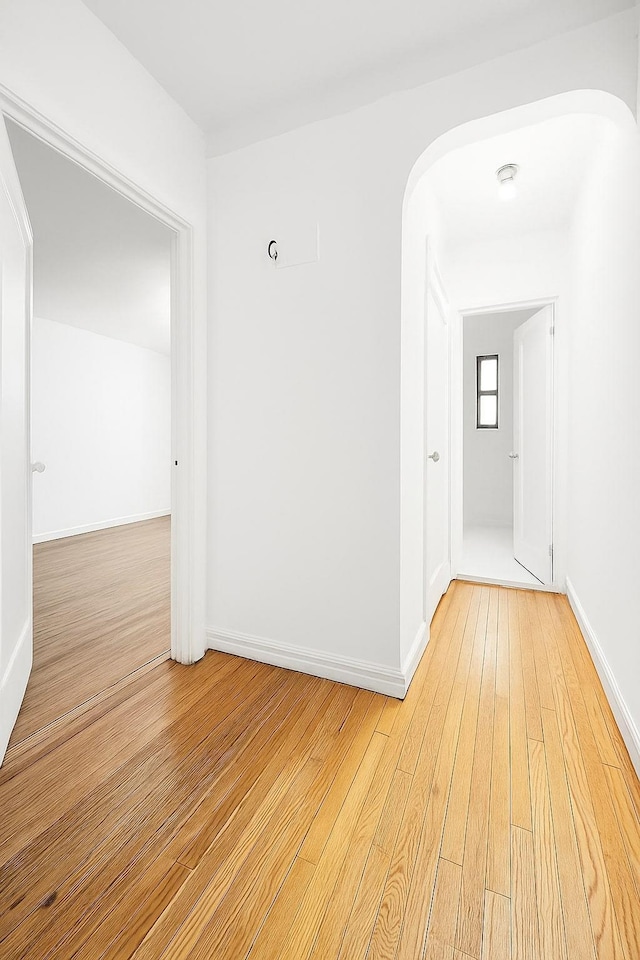 63109 Saunders St Unit 3A, Rego Park, NY 11374 - unfurnished room featuring light wood-style flooring and arched walkways