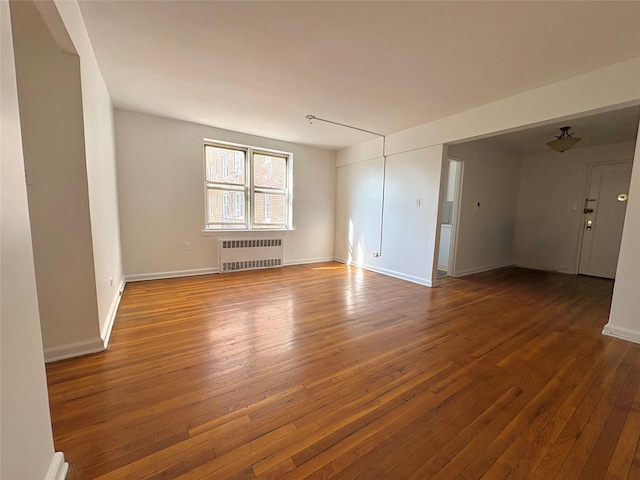 63-61 Yellowstone Blvd Unit 3E, Forest Hills, NY 11375 - unfurnished room featuring radiator heating unit and wood-type flooring