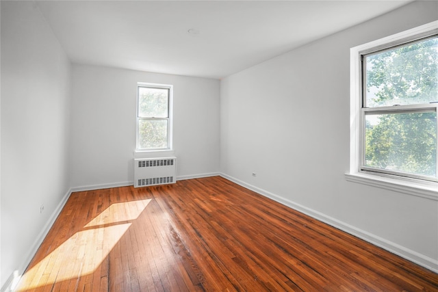 63-61 Yellowstone Blvd Unit 3E, Forest Hills, NY 11375 - spare room with radiator and hardwood / wood-style floors