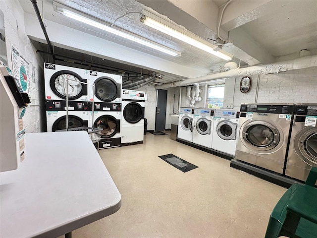 63-61 Yellowstone Blvd Unit 3E, Forest Hills, NY 11375 - communal laundry room featuring stacked washer / drying machine, washing machine and clothes dryer, and tile patterned floors