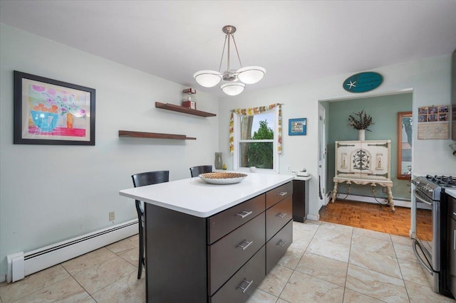 32 Brady Ave, New Rochelle, NY 10805 - kitchen featuring a baseboard heating unit, stainless steel range with gas cooktop, light countertops, and a chandelier