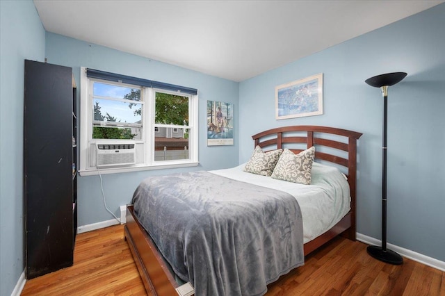 32 Brady Ave, New Rochelle, NY 10805 - bedroom with wood finished floors and cooling unit
