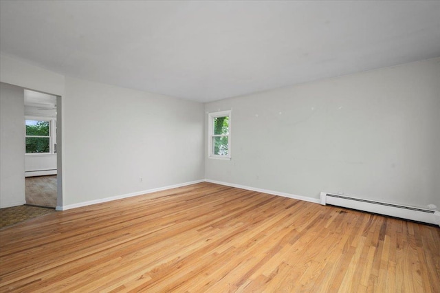 32 Brady Ave, New Rochelle, NY 10805 - unfurnished room with a baseboard radiator and wood finished floors