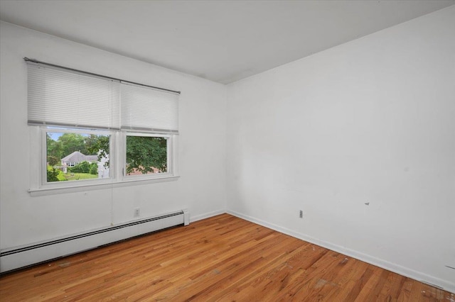 32 Brady Ave, New Rochelle, NY 10805 - unfurnished room with a baseboard radiator and light wood-type flooring