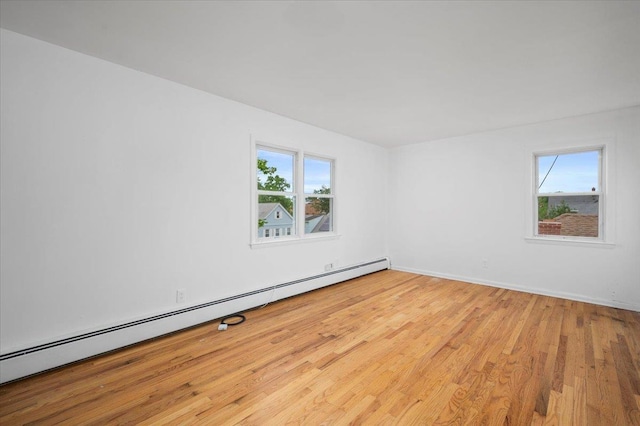 32 Brady Ave, New Rochelle, NY 10805 - unfurnished room featuring a baseboard radiator and wood finished floors