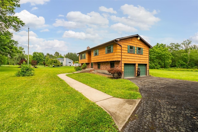 408 Bull Rd, Rock Tavern, NY 12575 - view of front facade with asphalt driveway, a garage, a front lawn, a chimney, and brick siding