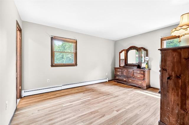 408 Bull Rd, Rock Tavern, NY 12575 - unfurnished bedroom with a baseboard heating unit and wood finished floors