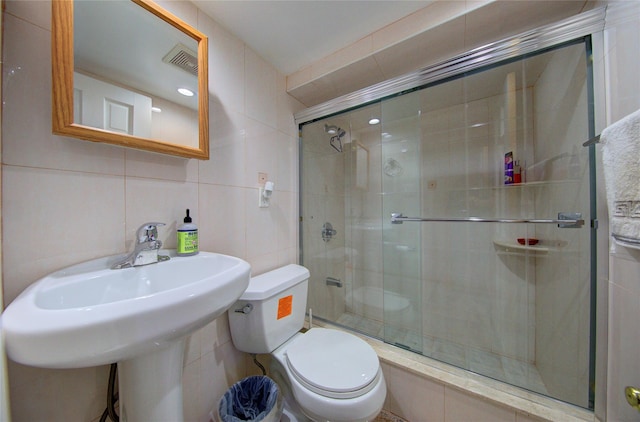 7622 265th St, New Hyde Park, NY 11040 - bathroom featuring tile walls and a shower stall