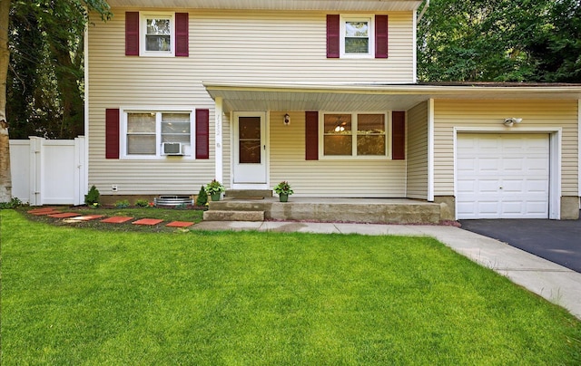 1152 N Country Rd, Stony Brook, NY 11790 - view of front of property featuring a porch, a garage, cooling unit, and asphalt driveway