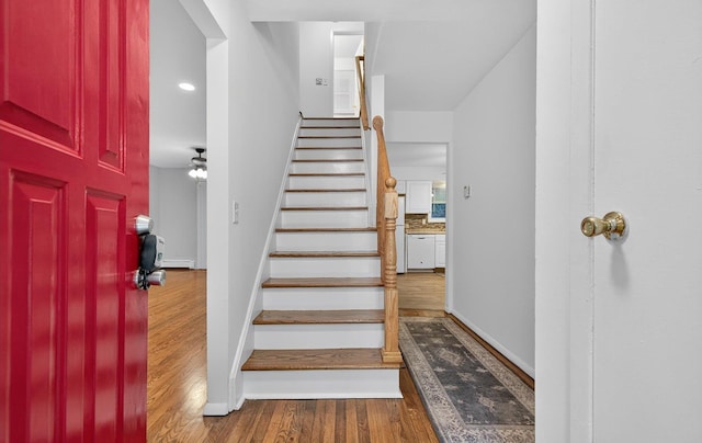 1152 N Country Rd, Stony Brook, NY 11790 - stairs featuring wood finished floors and a ceiling fan