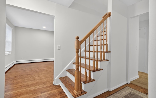 1152 N Country Rd, Stony Brook, NY 11790 - stairway featuring wood finished floors, recessed lighting, and baseboard heating