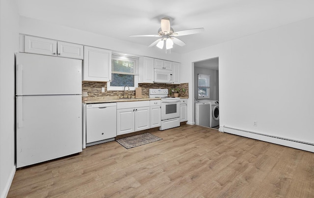 1152 N Country Rd, Stony Brook, NY 11790 - kitchen featuring white appliances, washer and dryer, white cabinetry, light countertops, and light wood-style flooring