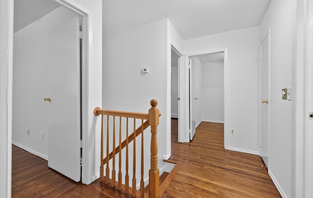 1152 N Country Rd, Stony Brook, NY 11790 - hall featuring an upstairs landing and wood finished floors