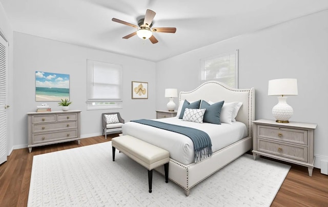 1152 N Country Rd, Stony Brook, NY 11790 - bedroom featuring multiple windows, wood finished floors, and ceiling fan