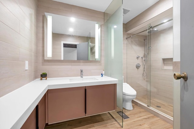 3 Horseshoe Ln, Great Neck, NY 11020 - full bath featuring vanity, a tile shower, and wood finished floors