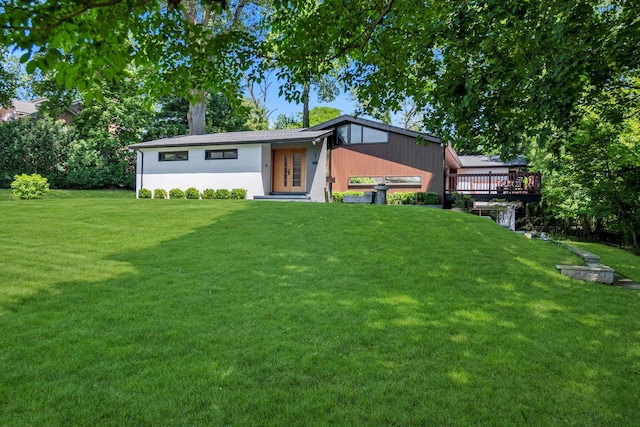 3 Horseshoe Ln, Great Neck, NY 11020 - back of property featuring a yard and a deck