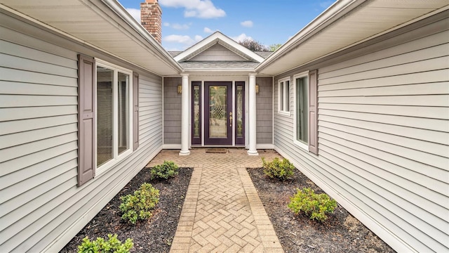 12 Hasting Dr, Stony Brook, NY 11790 - property entrance featuring a patio and a chimney
