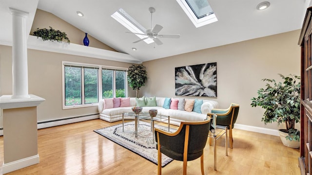 12 Hasting Dr, Stony Brook, NY 11790 - living room featuring baseboard heating, ornate columns, a skylight, recessed lighting, and light wood-style floors