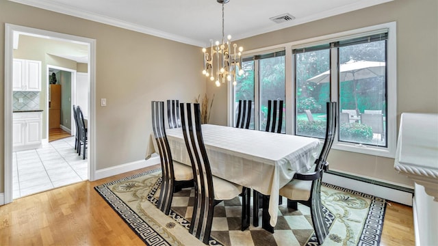 12 Hasting Dr, Stony Brook, NY 11790 - dining space featuring a baseboard heating unit, a chandelier, light wood finished floors, and ornamental molding