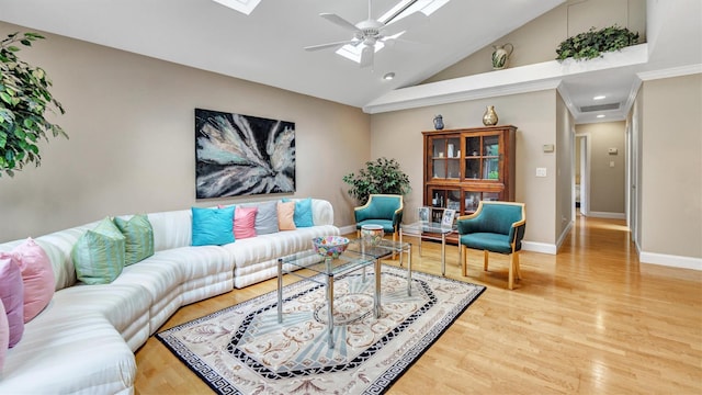 12 Hasting Dr, Stony Brook, NY 11790 - living area featuring a skylight, light wood-style flooring, ceiling fan, high vaulted ceiling, and recessed lighting