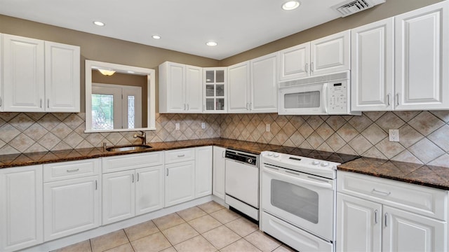 12 Hasting Dr, Stony Brook, NY 11790 - kitchen featuring white appliances, glass insert cabinets, dark stone countertops, white cabinets, and recessed lighting