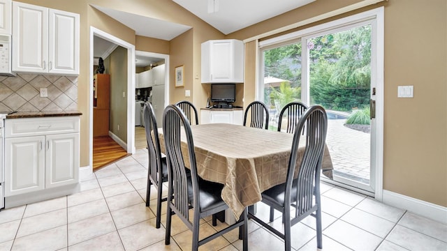12 Hasting Dr, Stony Brook, NY 11790 - dining space featuring light tile patterned floors and lofted ceiling